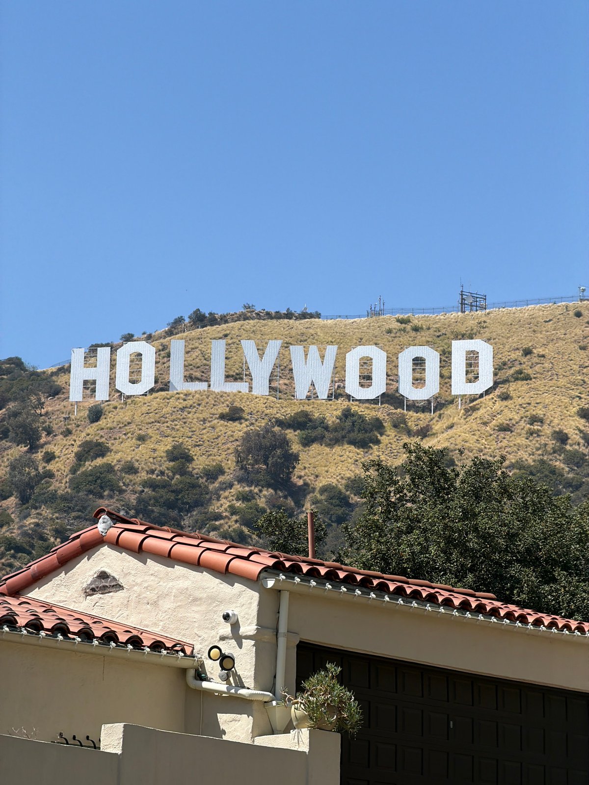 Hollywood Sign photographed against clear Los Angeles skies