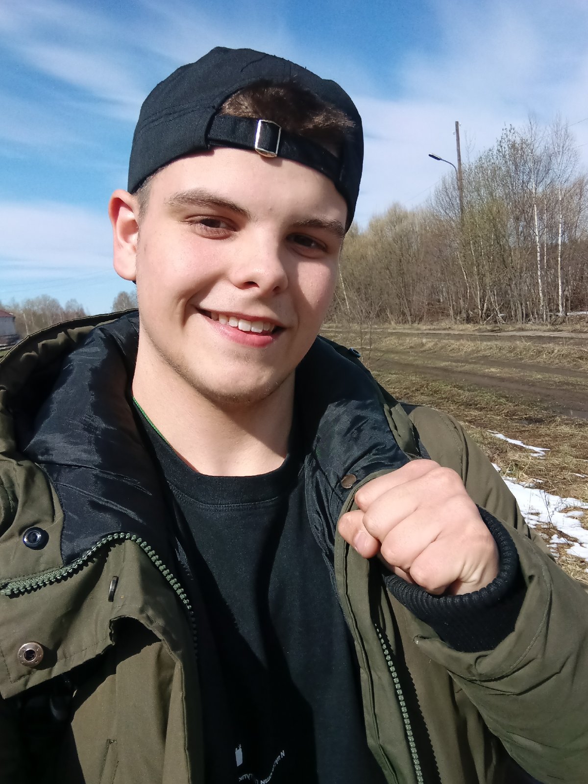 Young man takes selfies by railway tracks in Andreyevo