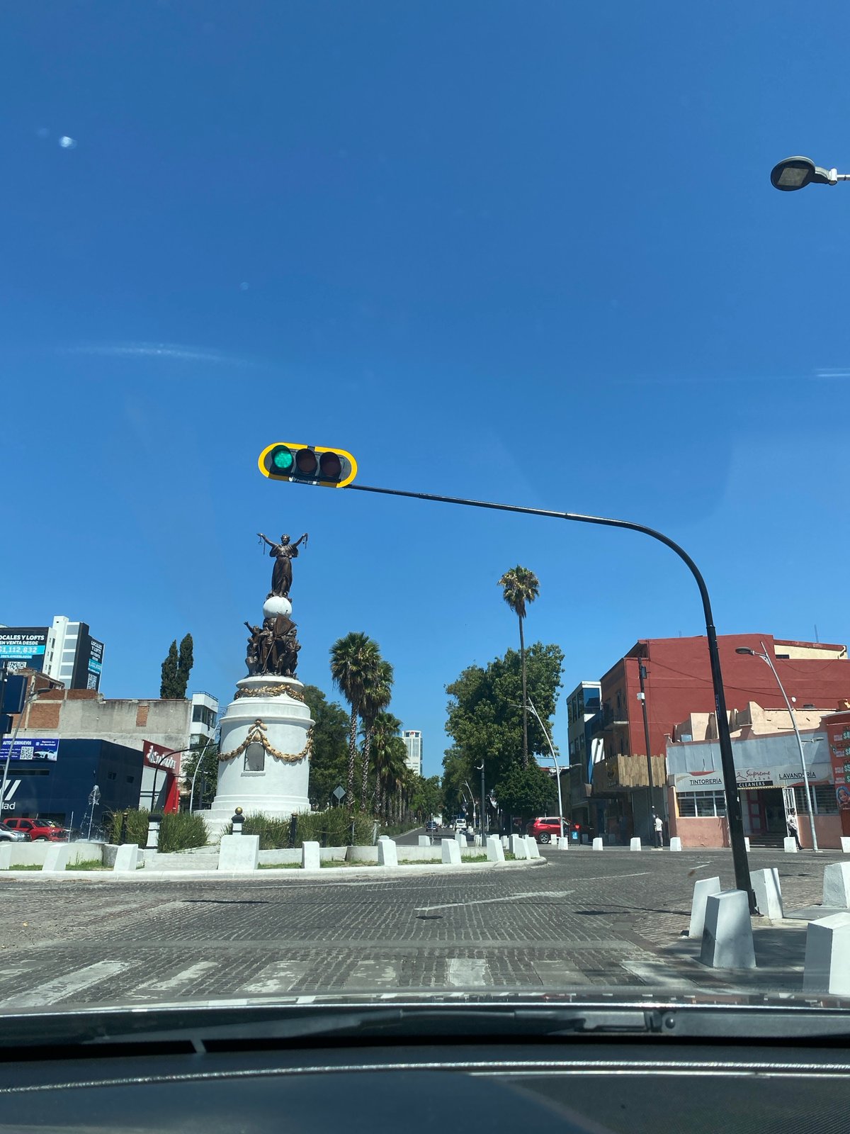 Puebla scenes: street monument and classroom captured same afternoon
