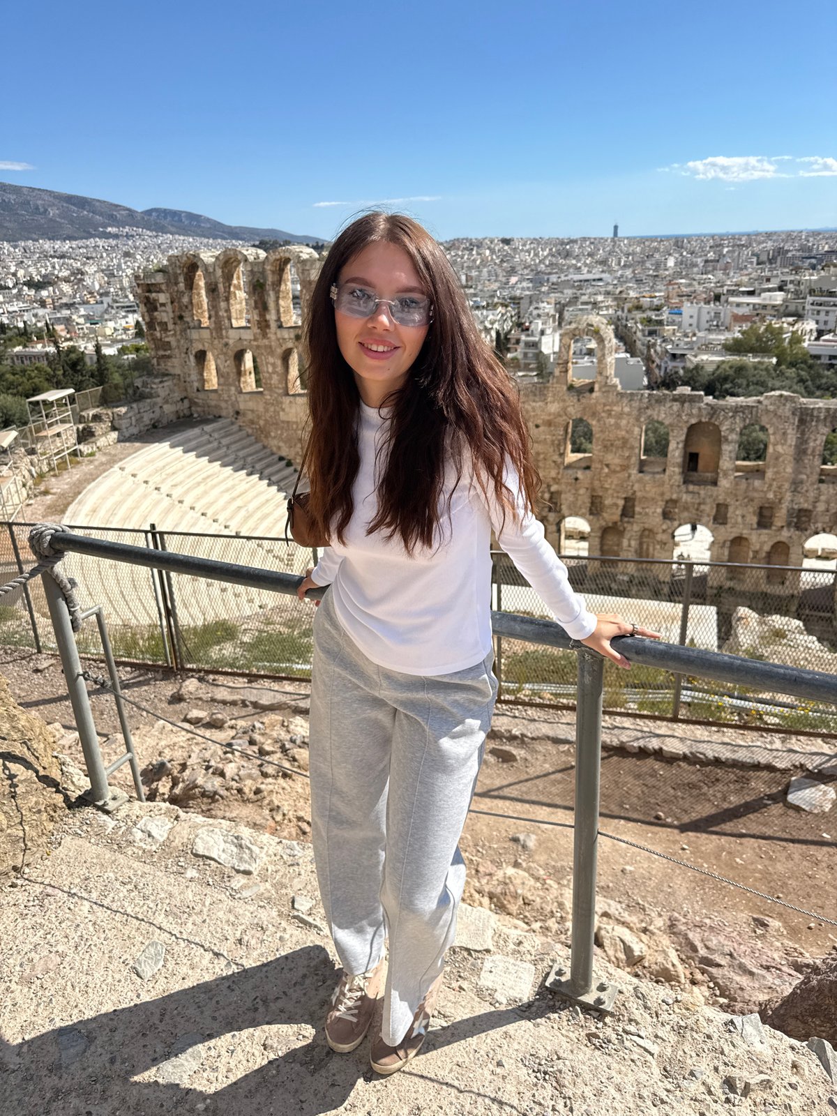 Tourists visit ancient Odeon theater on Athens Acropolis