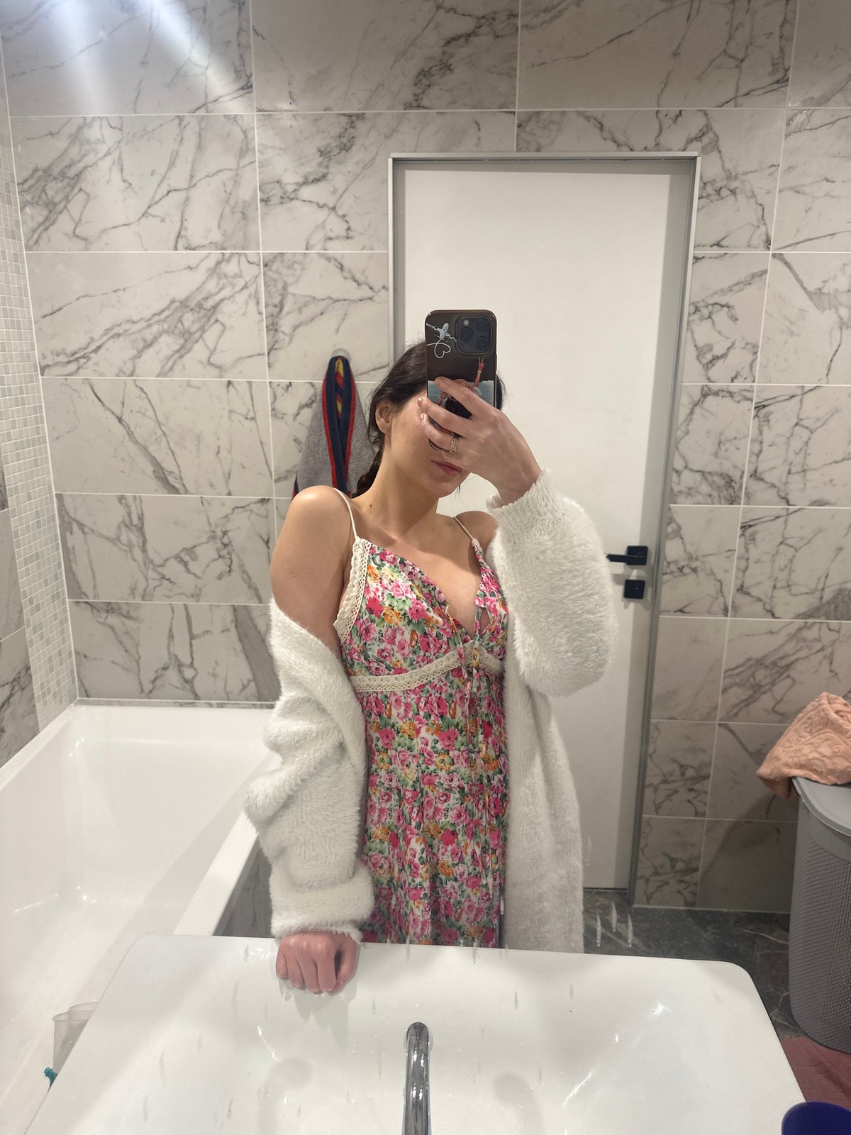 Outfit selfies and kids' ride-on toys on a patio