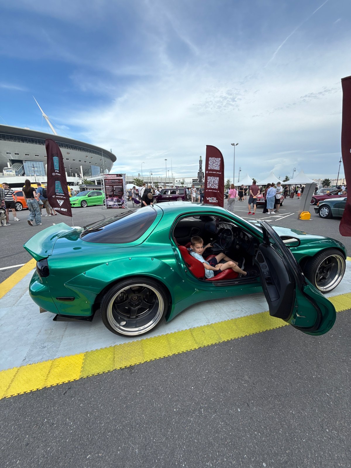 Custom car show rolls through Saint Petersburg on midsummer afternoon