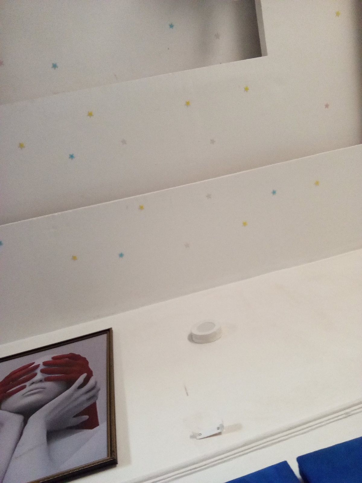 Room Interior Features Star Decals and Eye-Covering Portrait