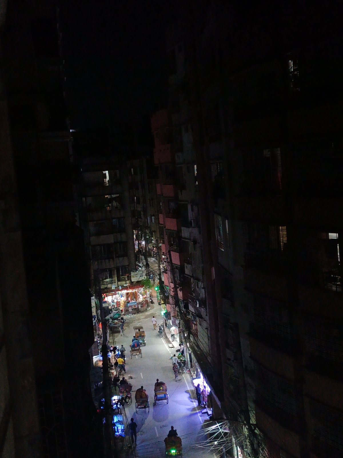 Nighttime urban street activity captured from elevated perspectives