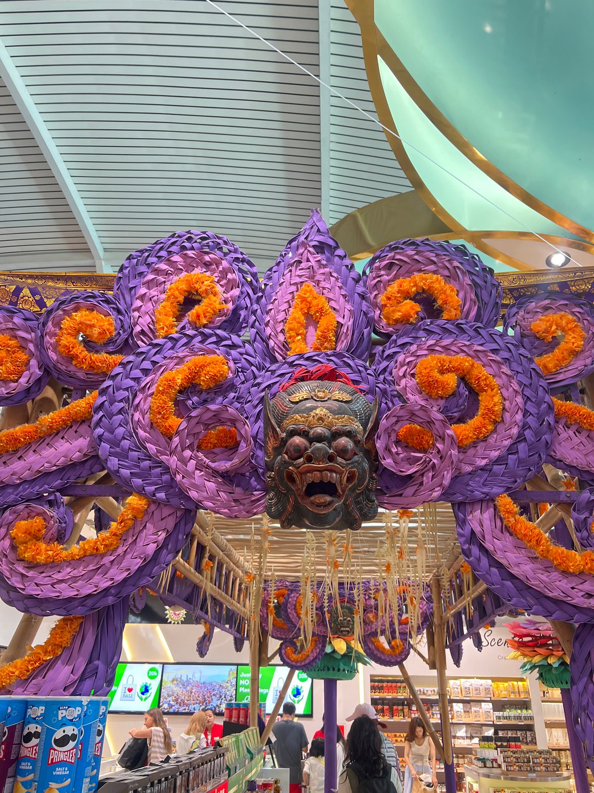 Bali airport departure area decked in vivid Balinese decor