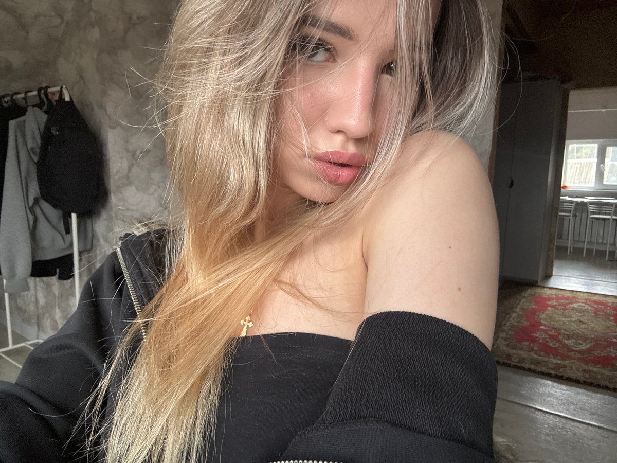 Woman photographed multiple times in Noviy, Russia indoor setting