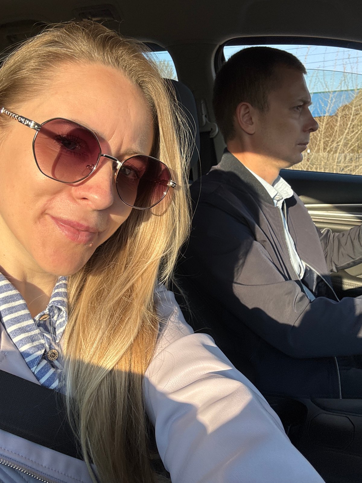 Two people photographed inside vehicle in Chaikovsky, Russia