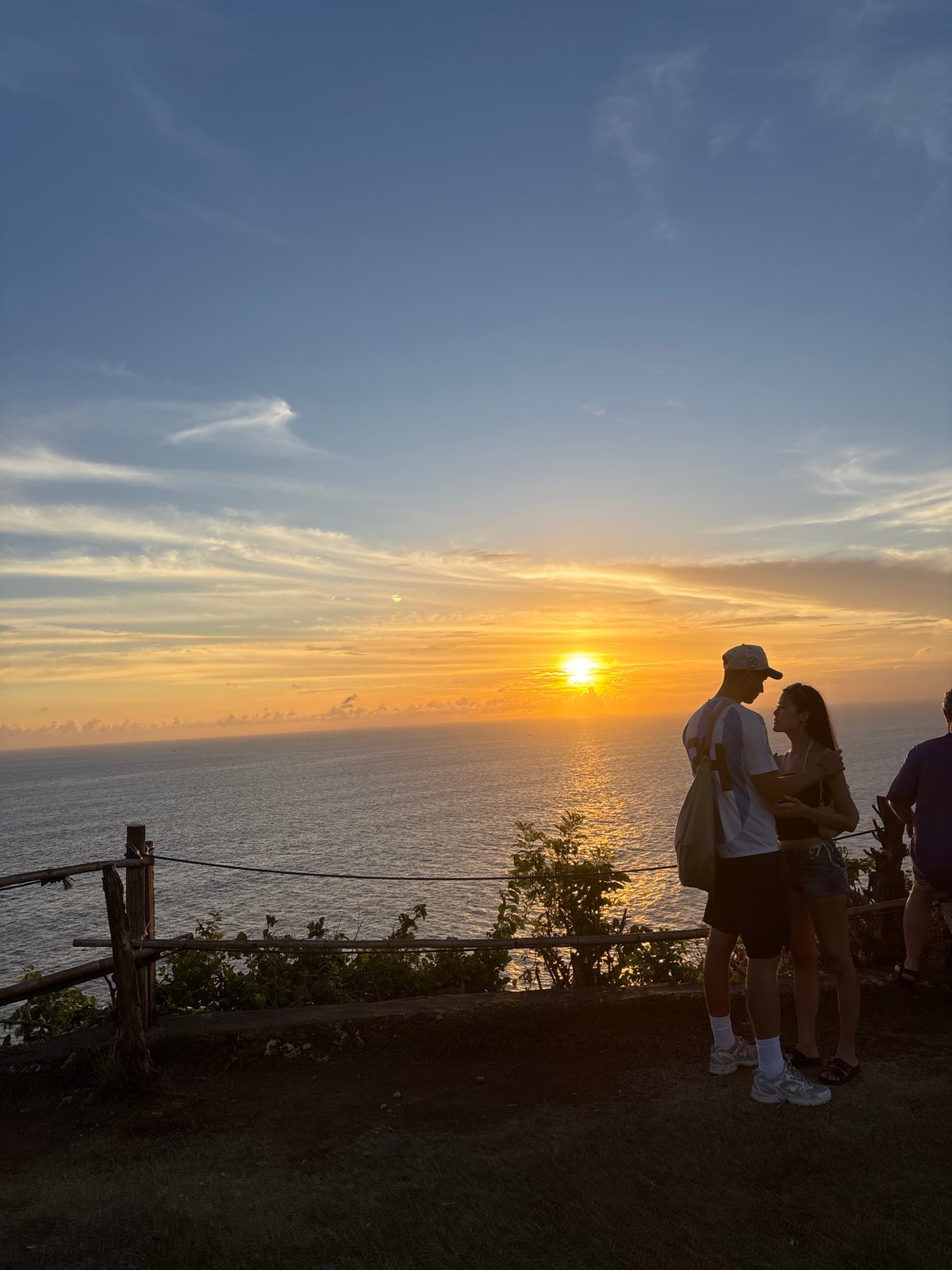 Tourists gather at Kuta Selatan clifftops for ocean viewing