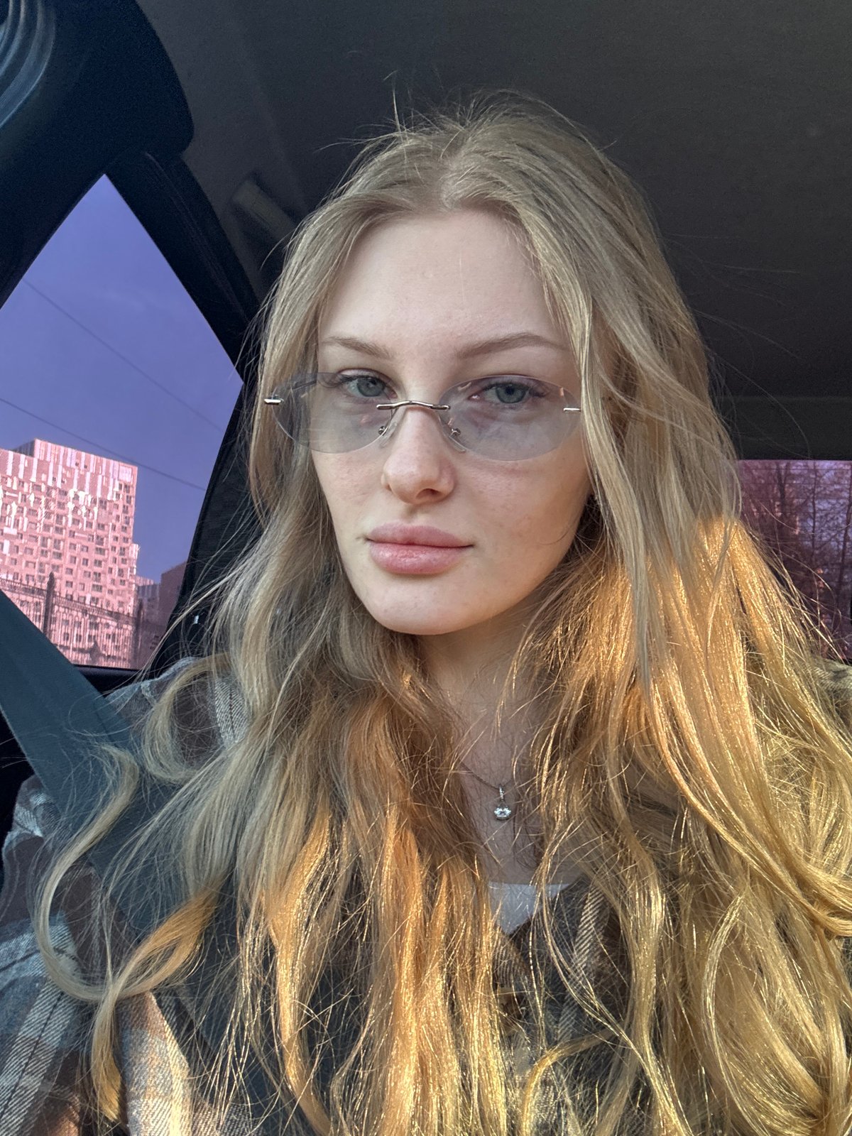 Woman takes car selfies in Perm, Russia