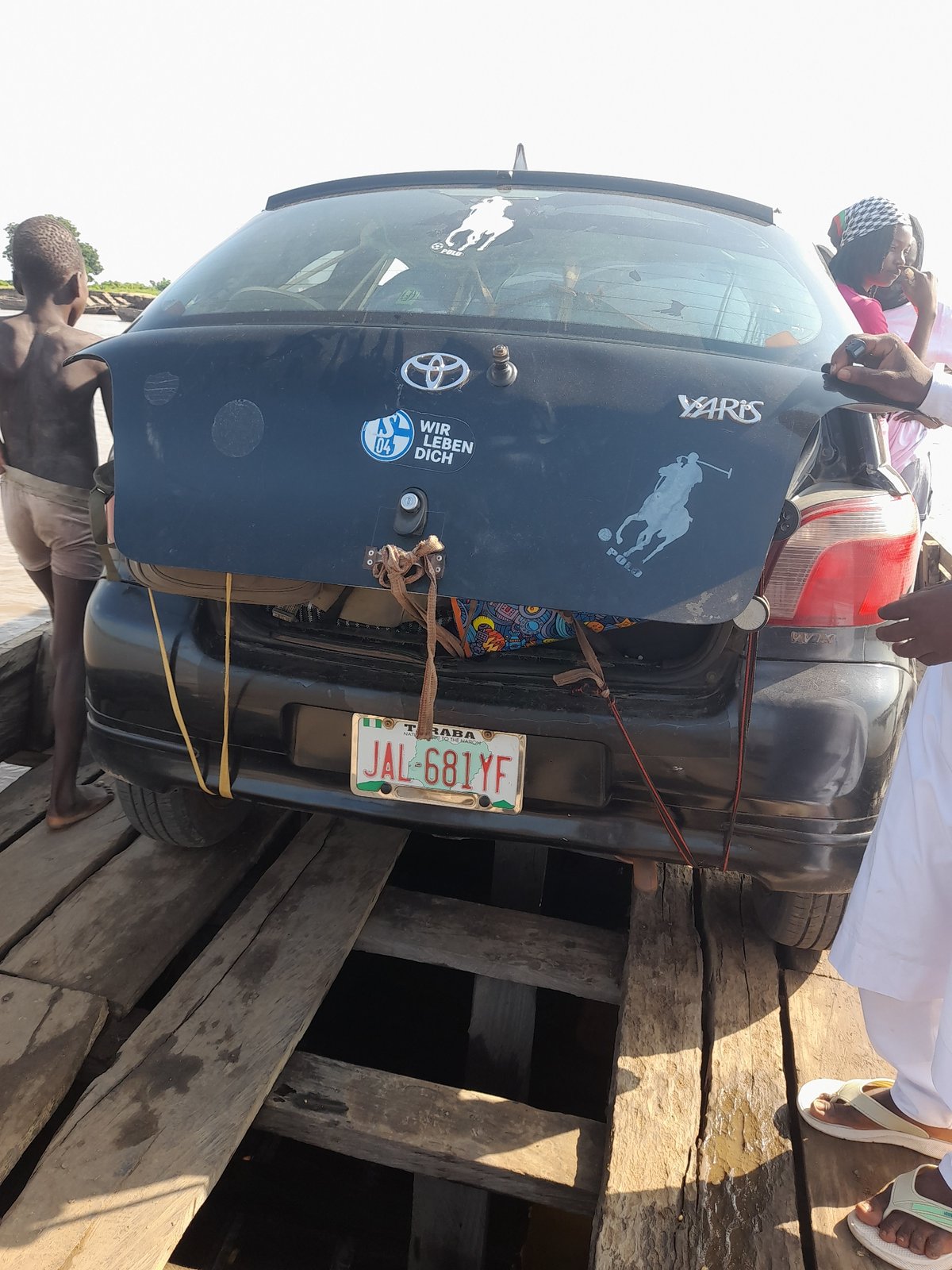 Ferry crossing and river activity at Nemnei, Nigeria