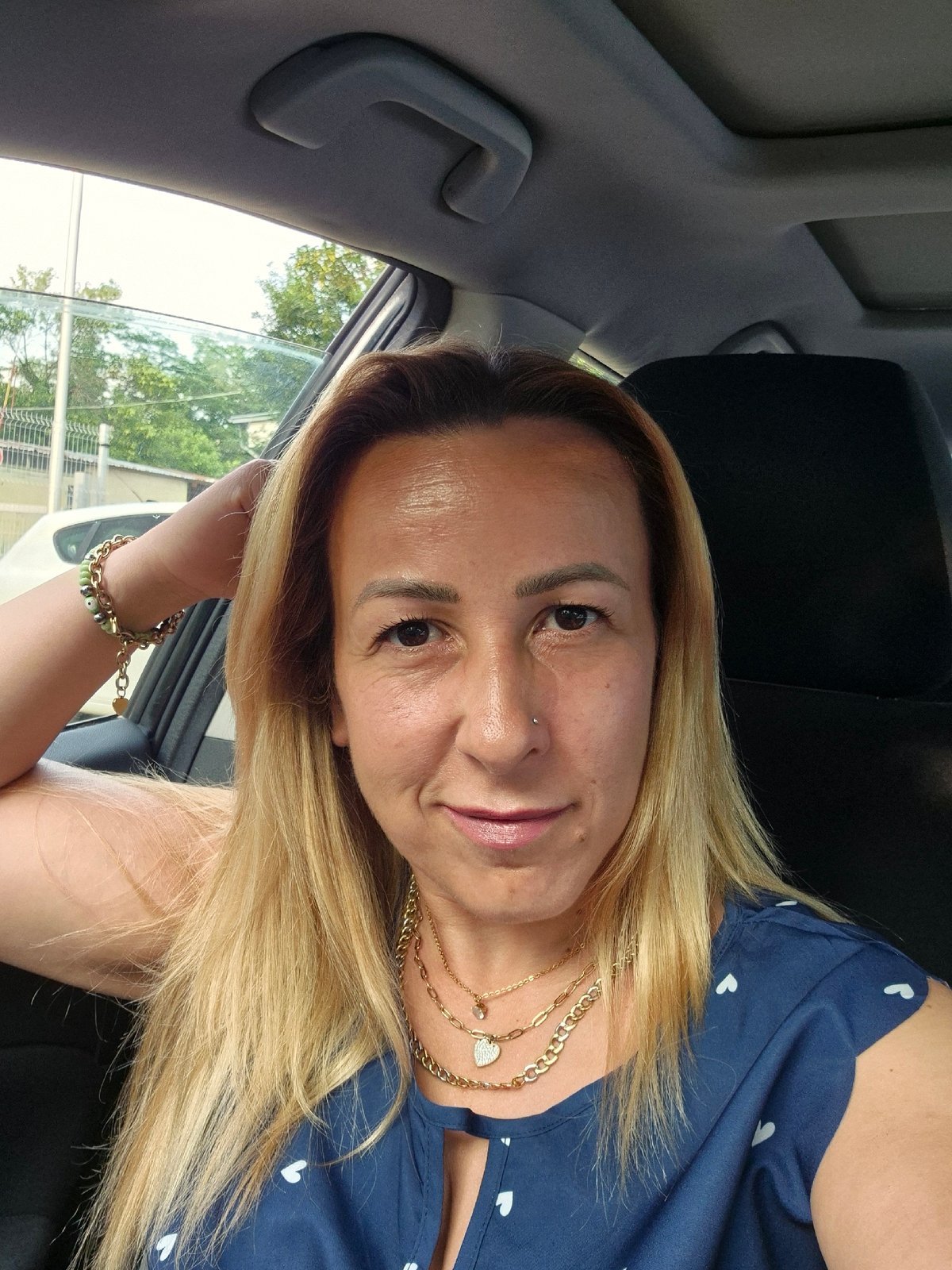 Selfies and car moments in a blue heart-print top