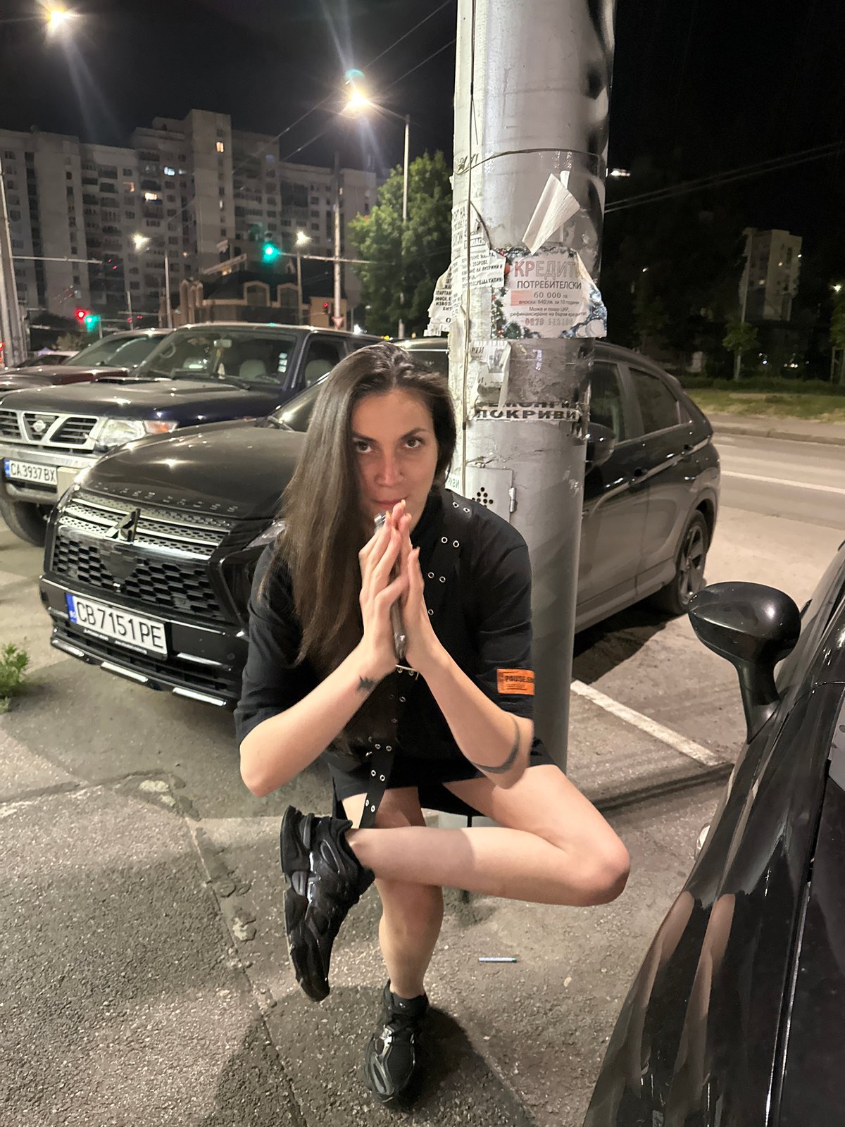 Young people document nighttime city outing with selfies, landmarks