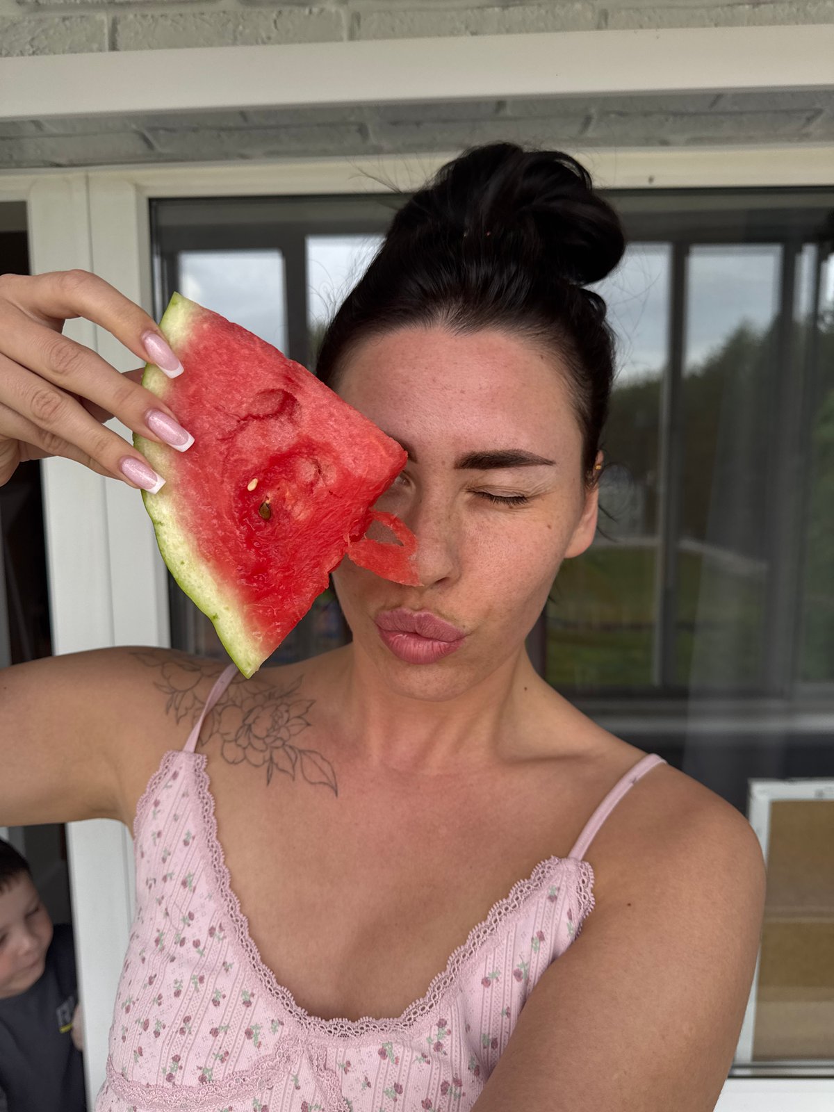 Family shares watermelon, playtime in Chaikovsky home