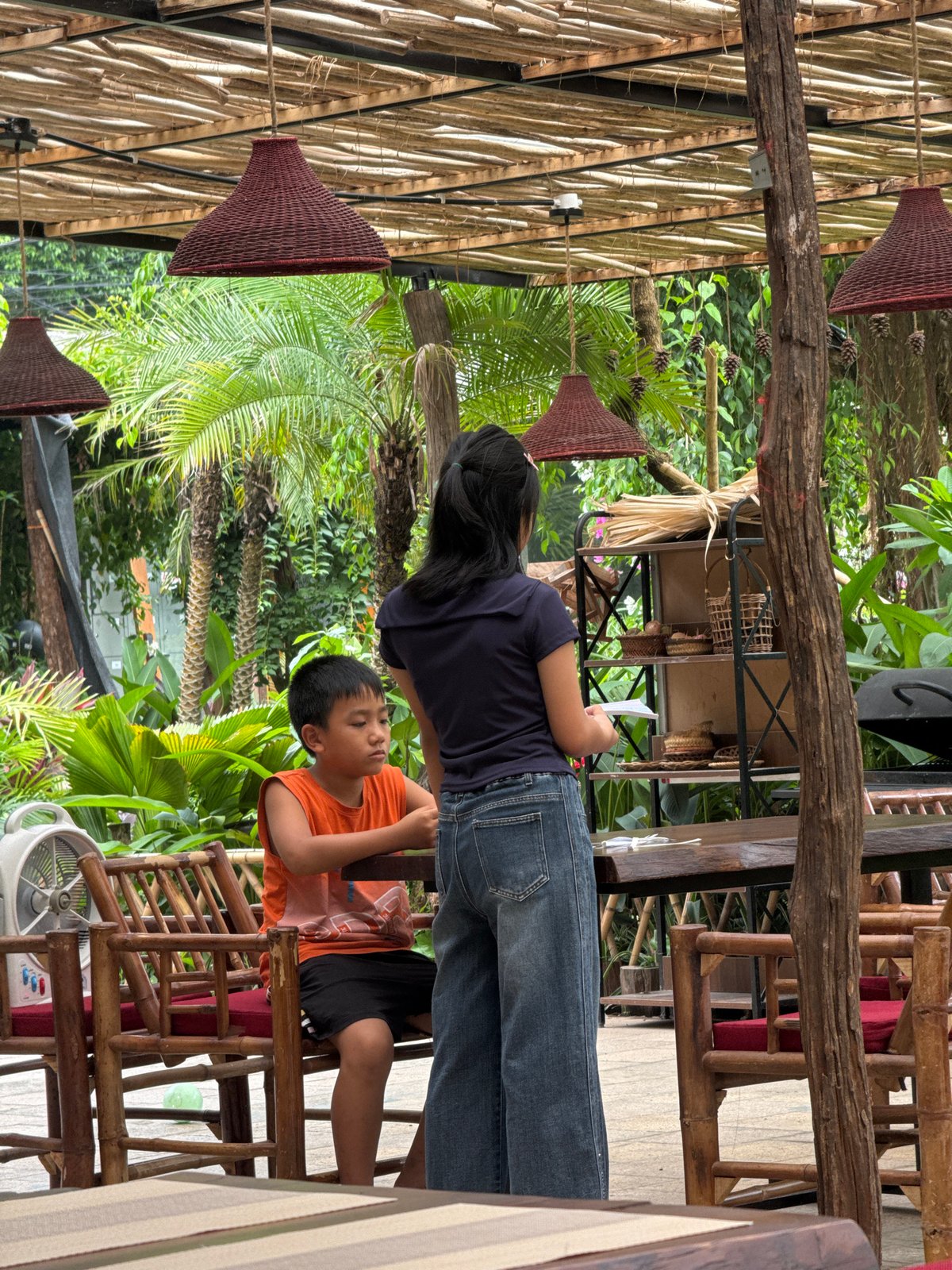 Late-night family dining captured at Vietnamese tropical restaurant