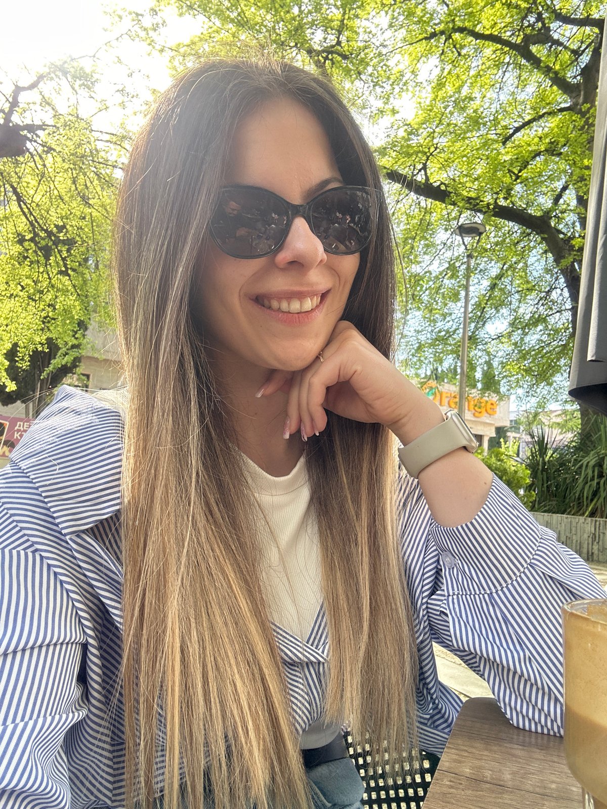Woman enjoys coffee selfie moment in Bulgarian city