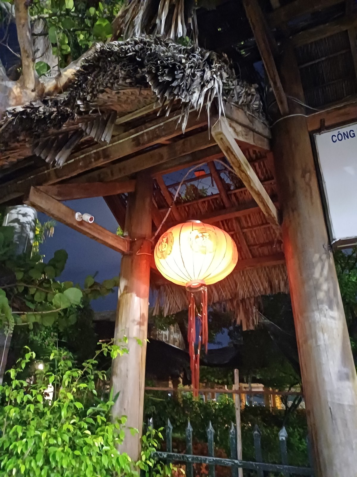 Nha Trang venue entrance glows with lanterns and blue pillars at night