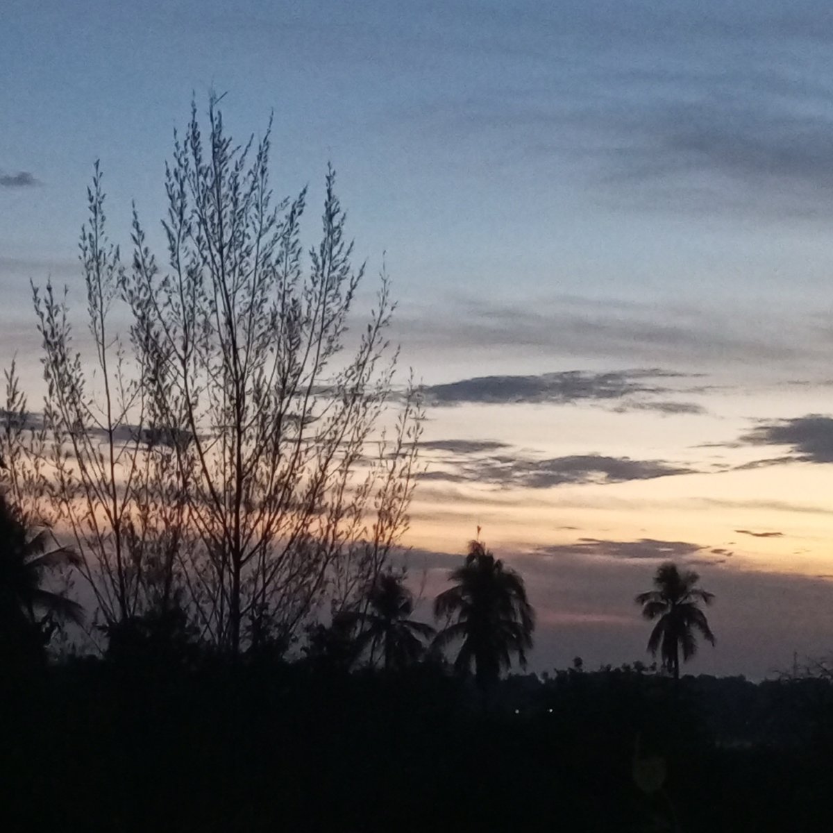 Twilight sky documented across Lhokseumawe, Indonesia cityscape