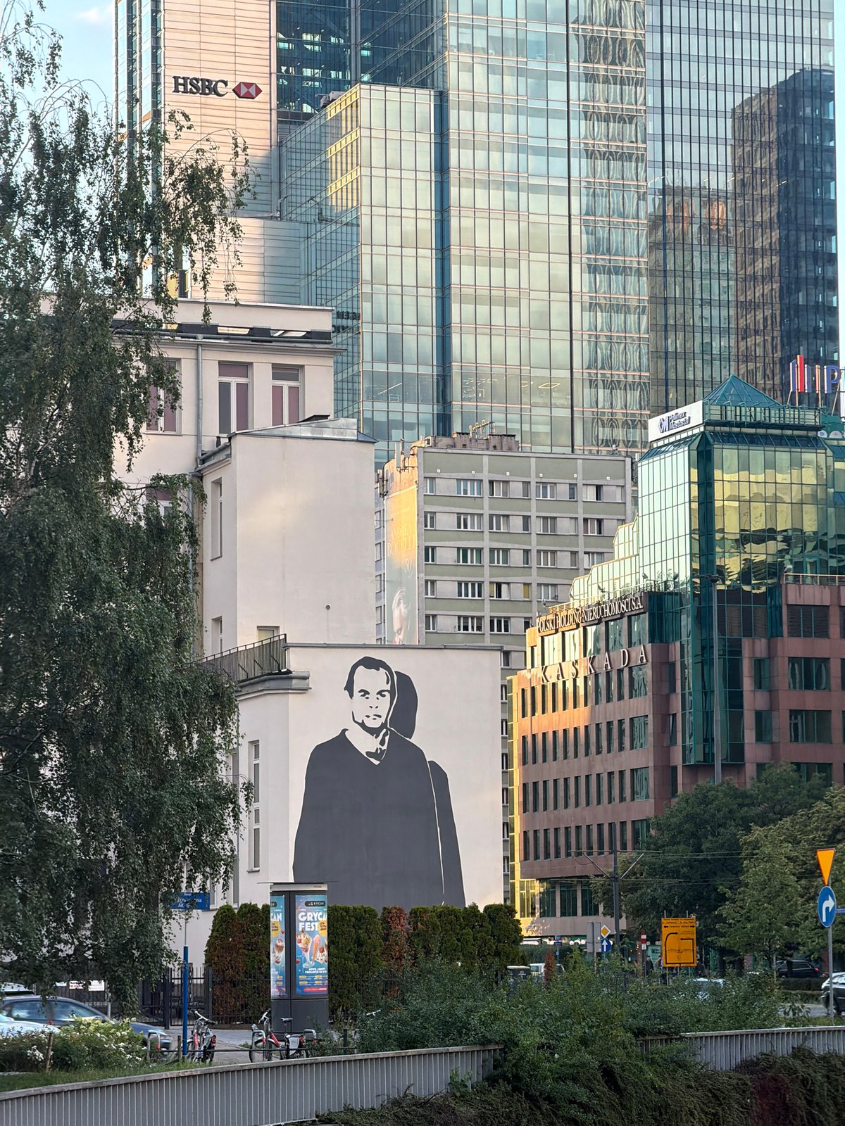 Street art, Soviet-era skyline, and a Warsaw greeting