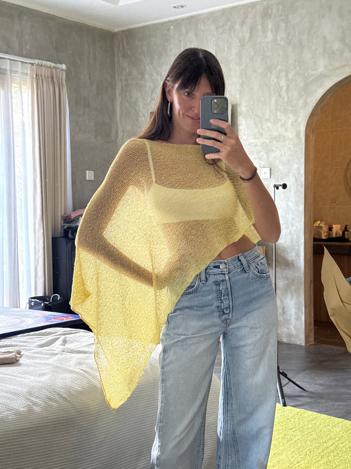 Woman takes mirror selfies in North Kuta room