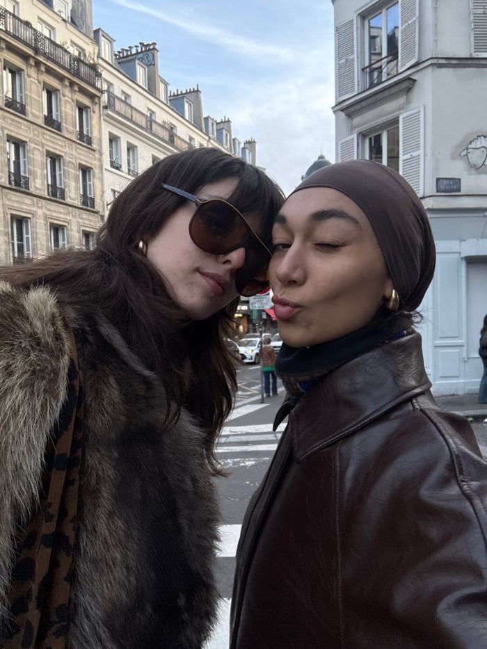 Two women document casual afternoon together in Paris streets