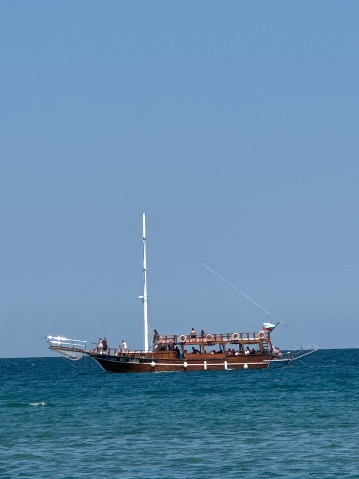 Boats on the Black Sea, books and coconut water on the beach
