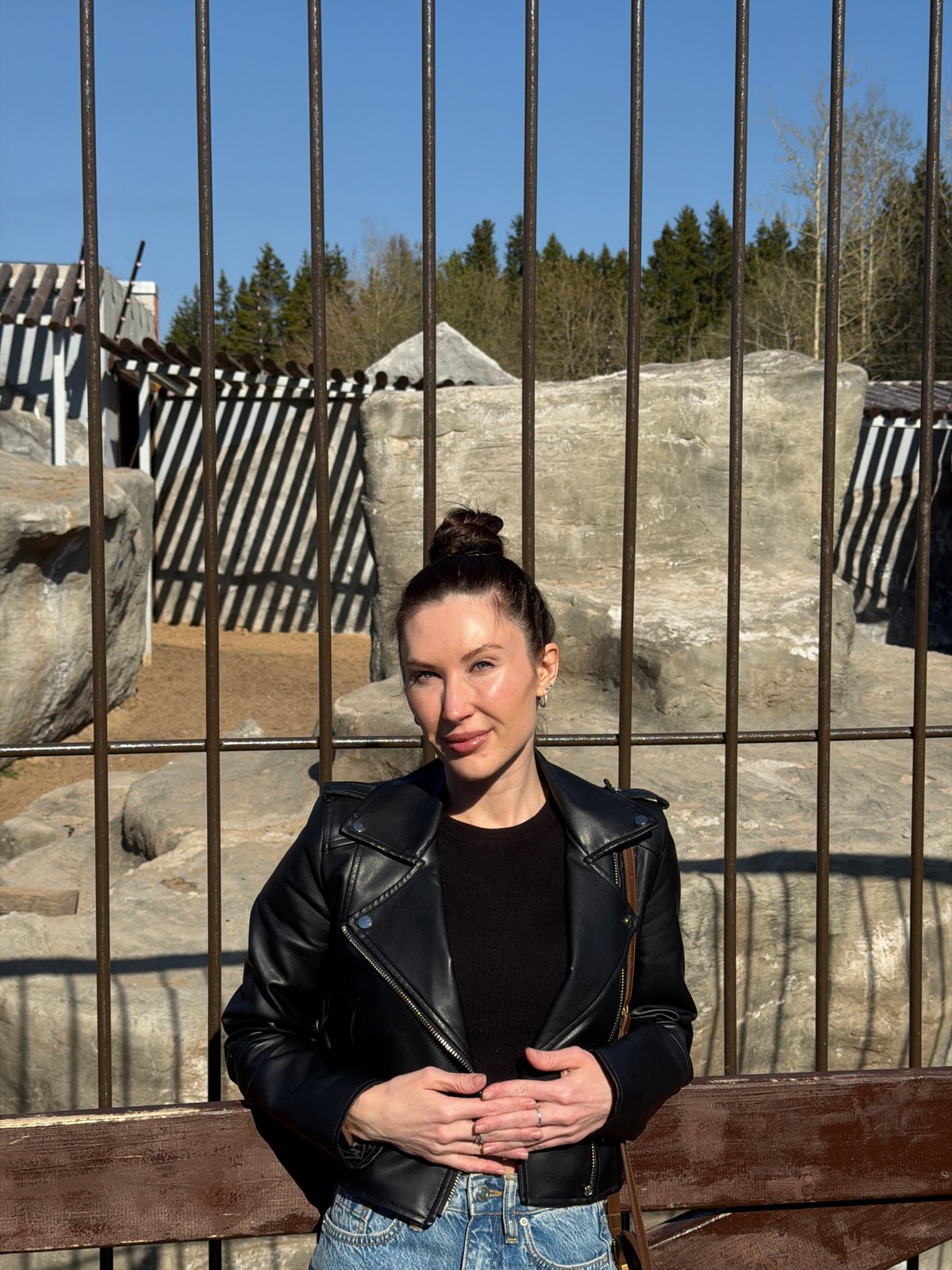 Visitor documents snow leopards during morning zoo visit in Perm