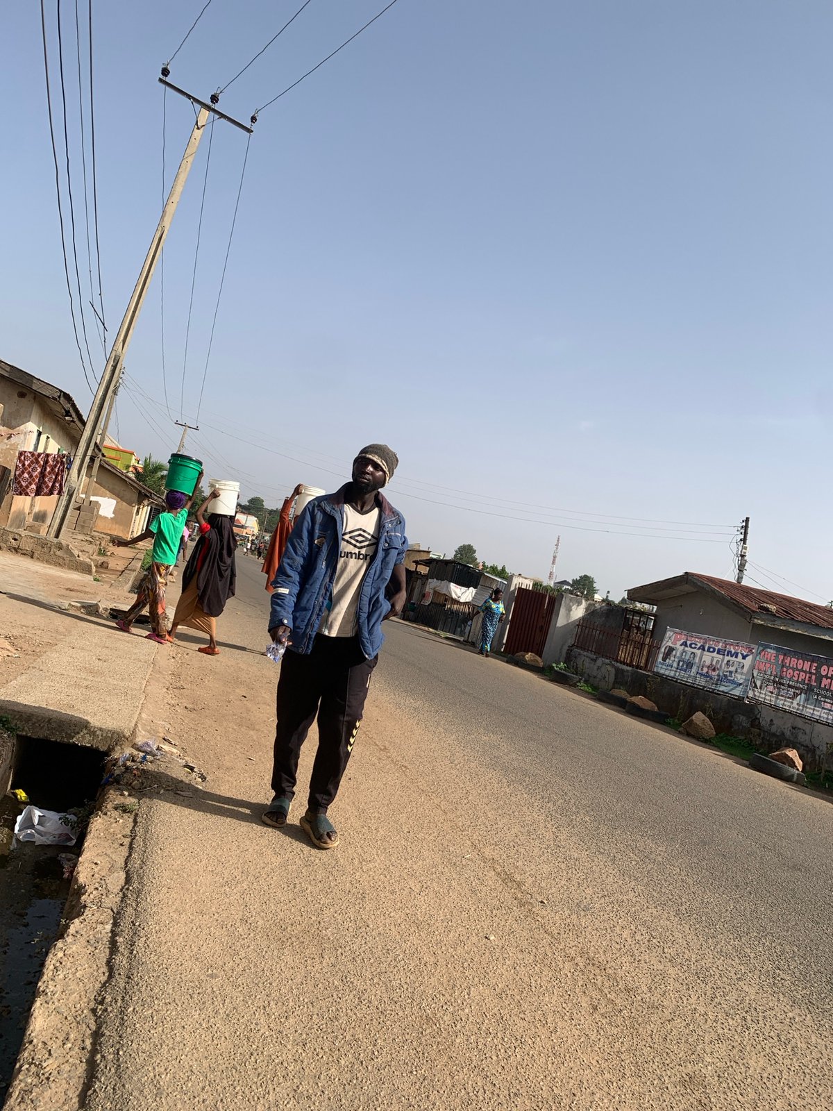 Morning street life documented across Jos, Nigeria neighborhoods