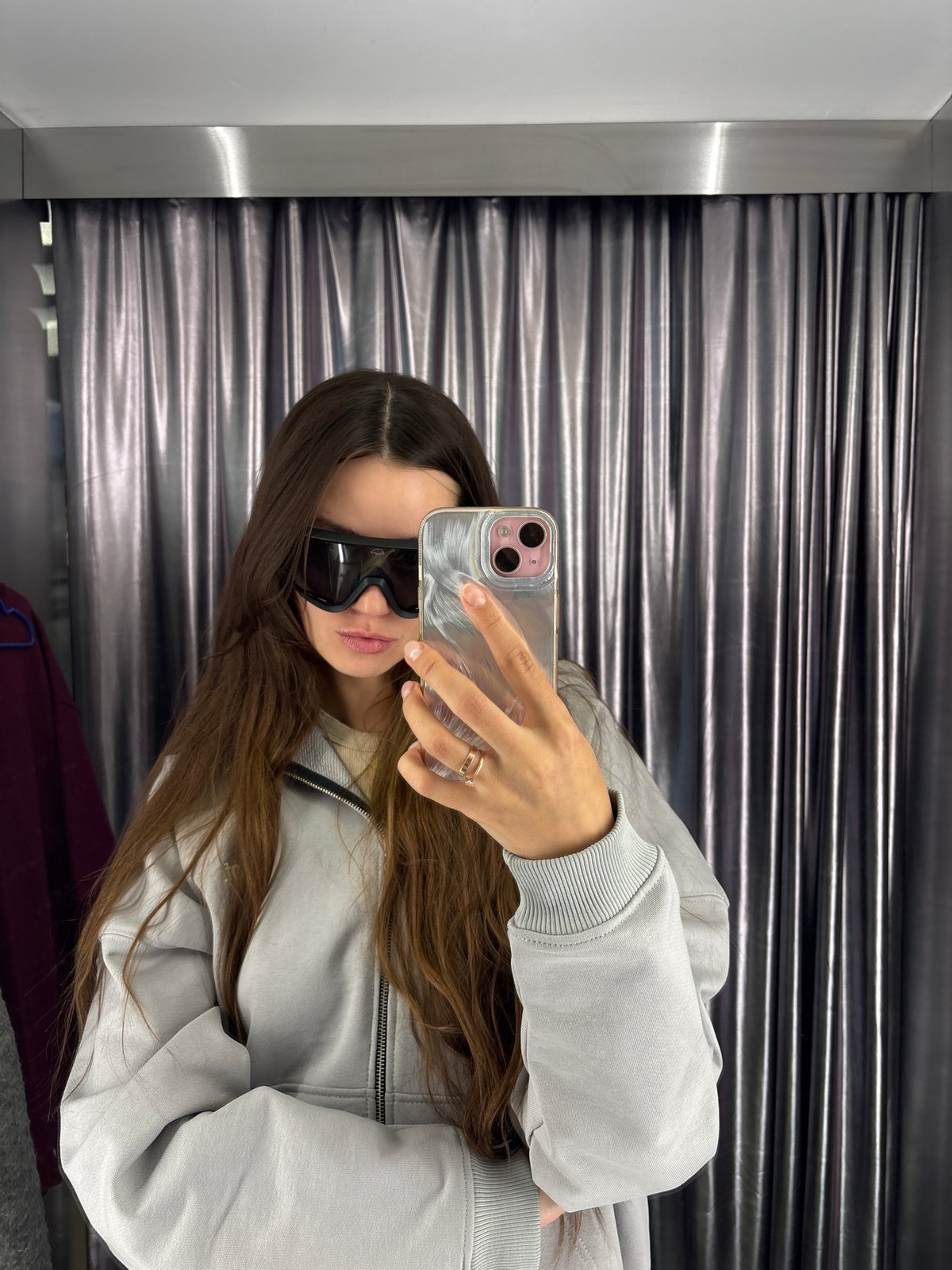 Woman takes selfies in metallic dressing room, Krasnoyarsk