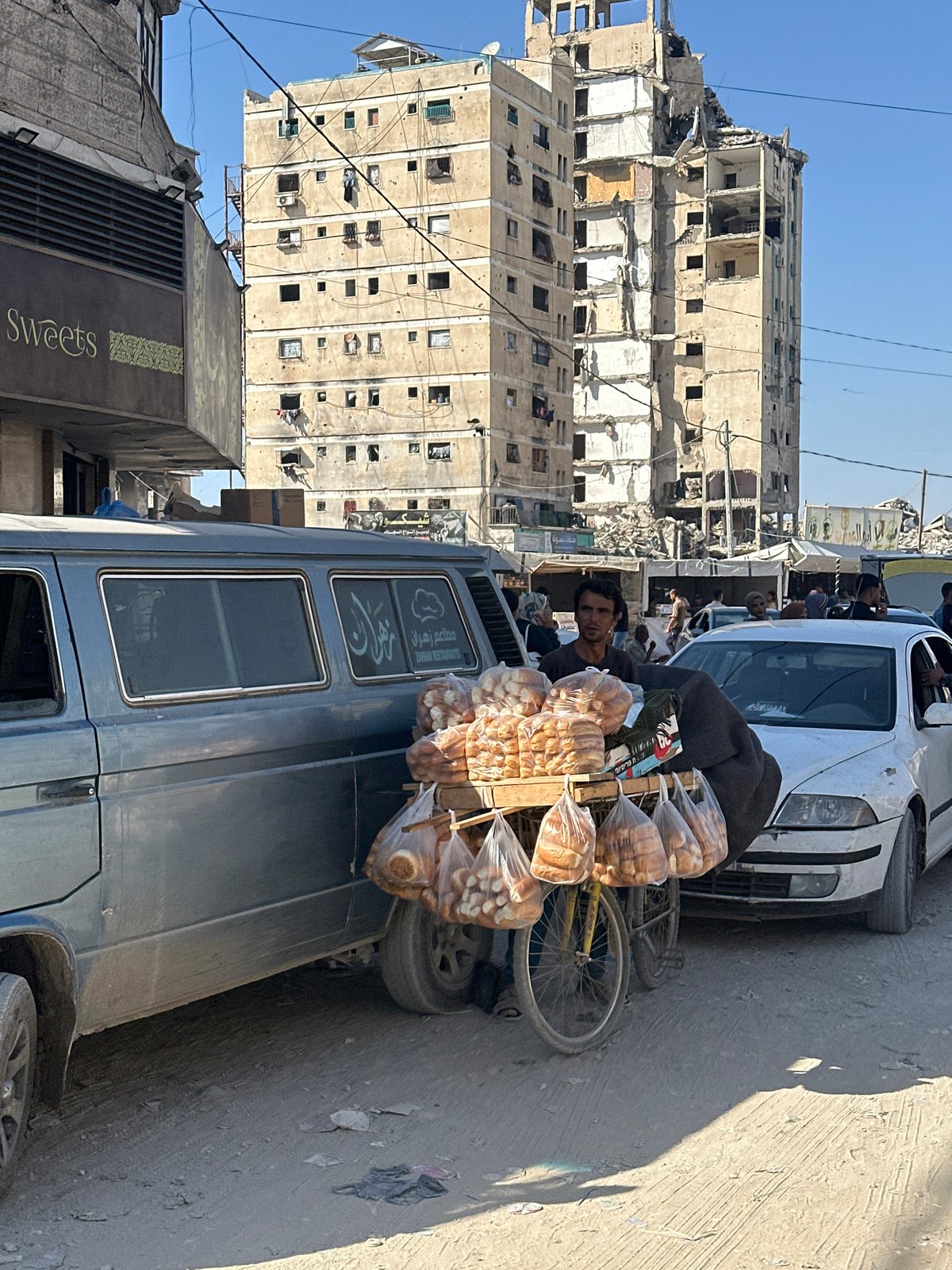 Street vendor sells bread from bicycle cart in Gaza City