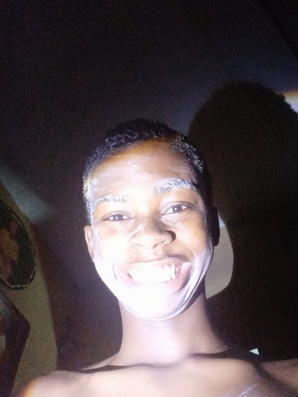Person documents grooming routine in Nkpor, Nigeria residence