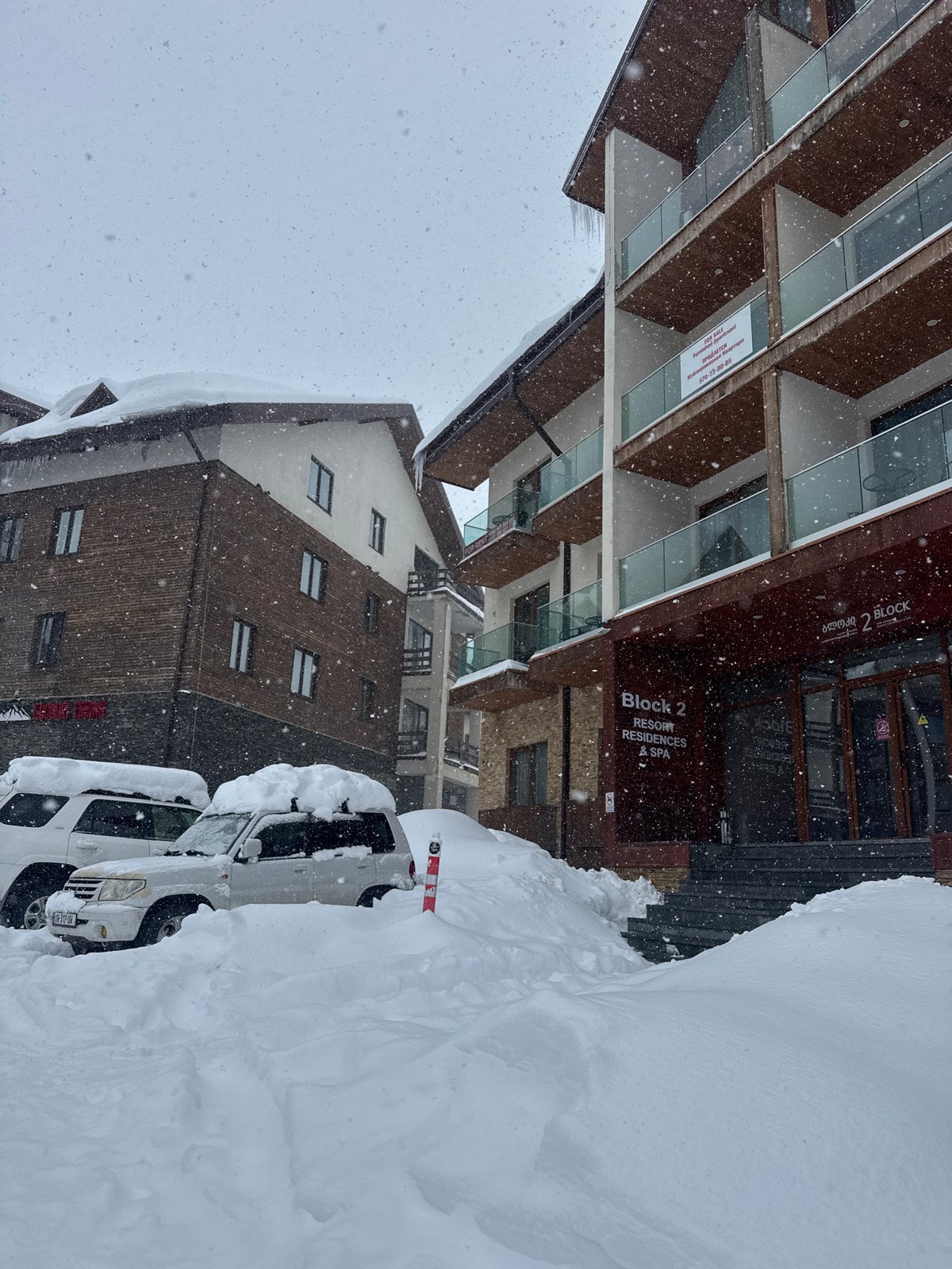 Heavy snowfall blankets mountain resort during morning hours