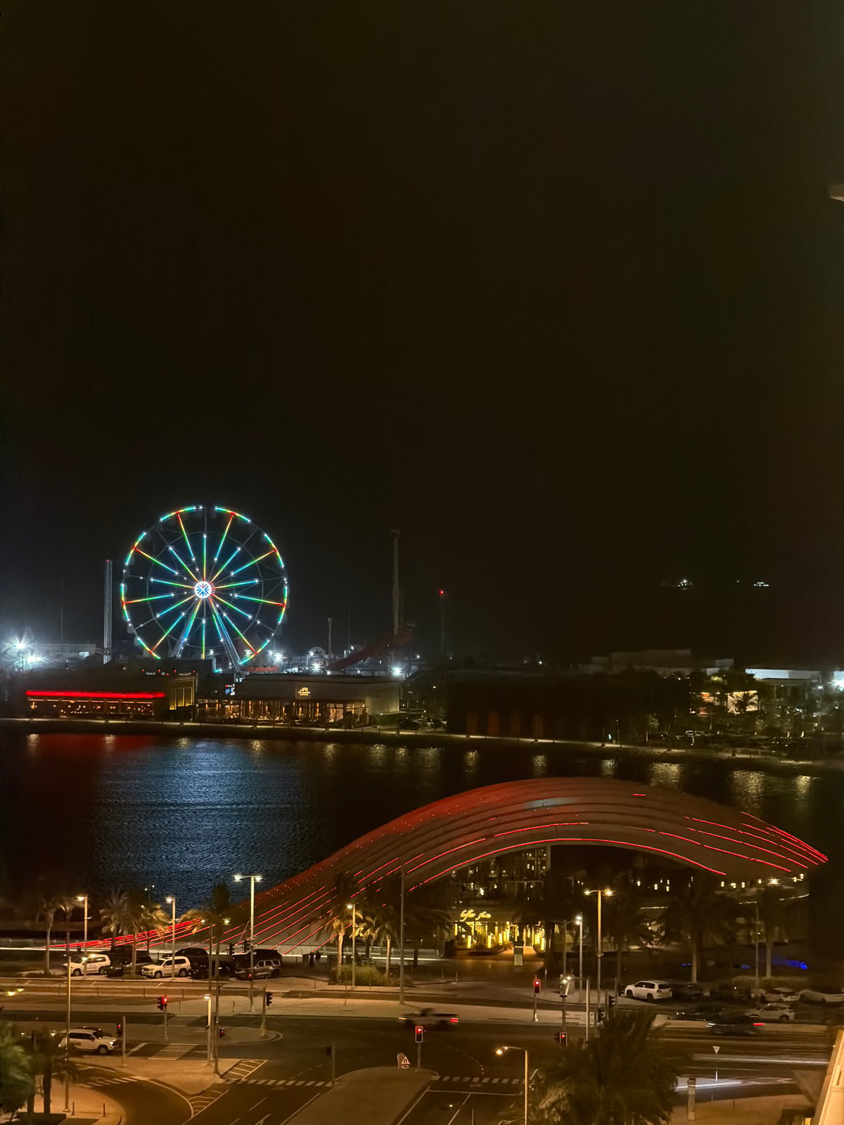 Night views across a glowing waterfront city