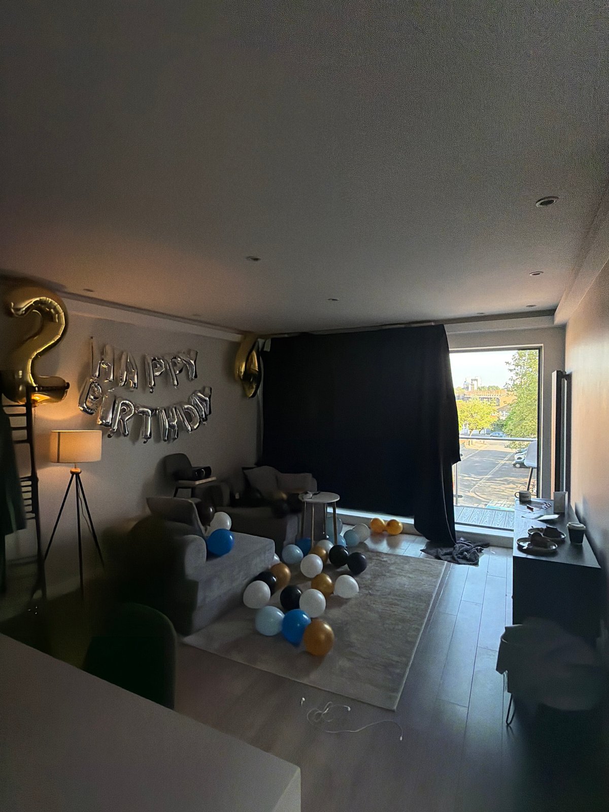 Birthday celebration with silver balloons observed in London home