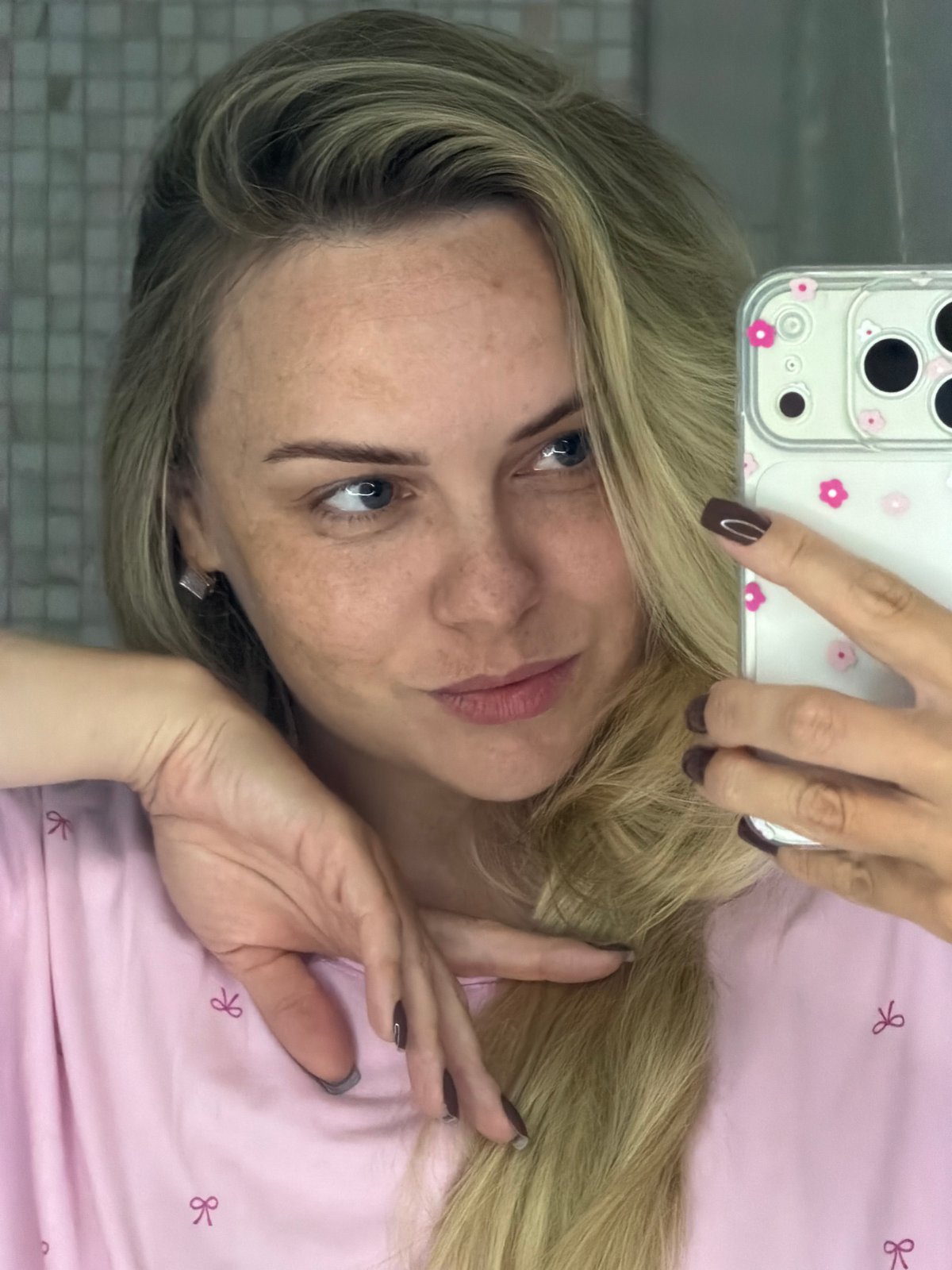 Woman takes bathroom selfies with small dog in Russia