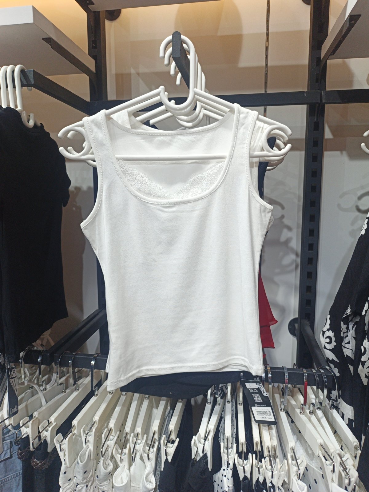 Browsing clothes and coffee in a Shymkent boutique