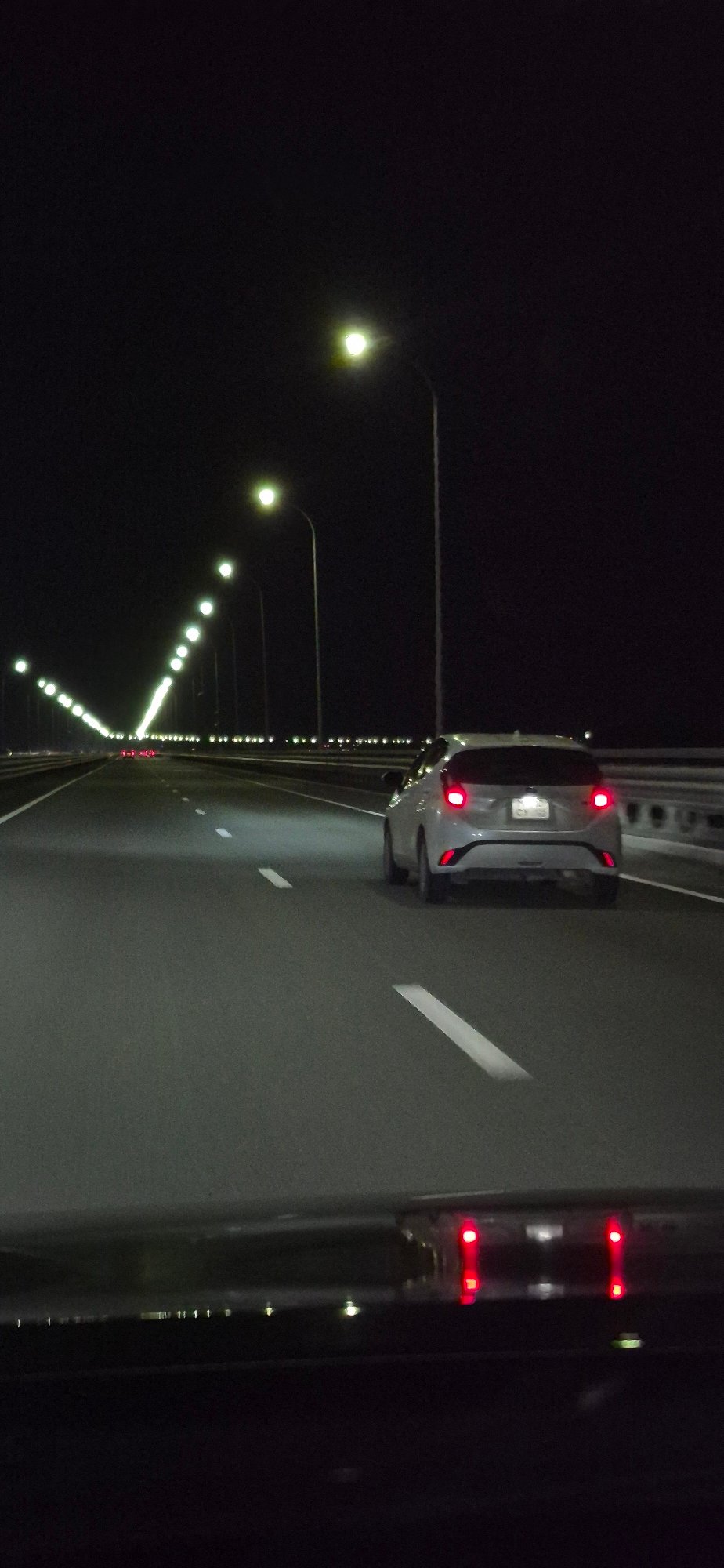 Night drive through lit-up Vladivostok highways