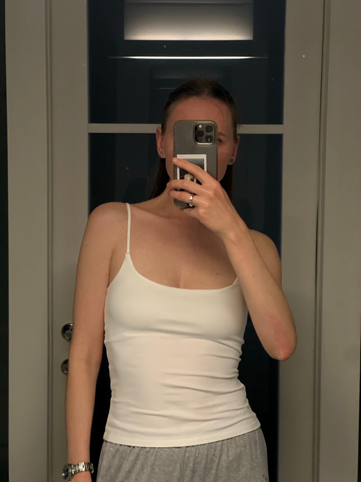 Woman takes mirror selfie in Khimki bathroom