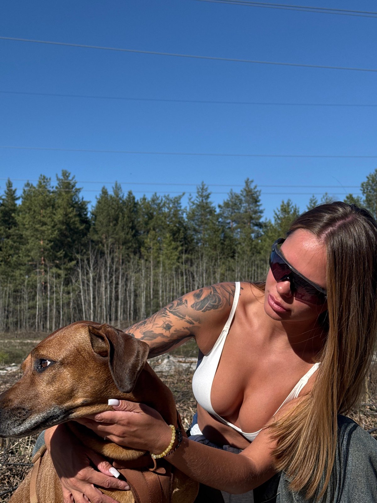 Women enjoy outdoor afternoon with dog in Nizhny Novgorod