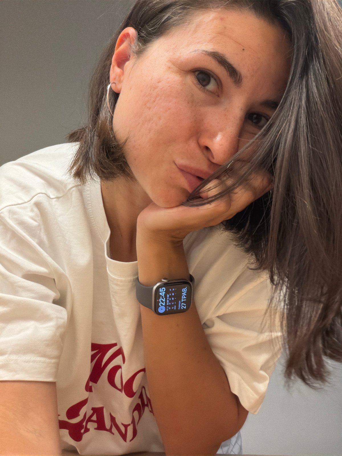 Woman takes multiple selfies indoors in Budva, Montenegro