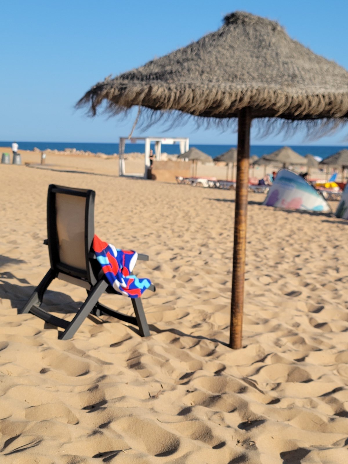 Sunny afternoon scenes across Quarteira's beach and streets