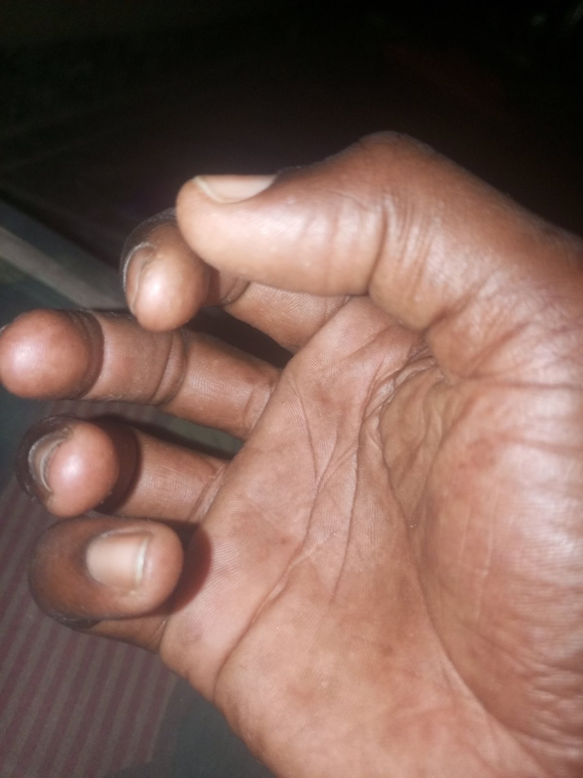 Nighttime close-up photos capture individuals in dark setting