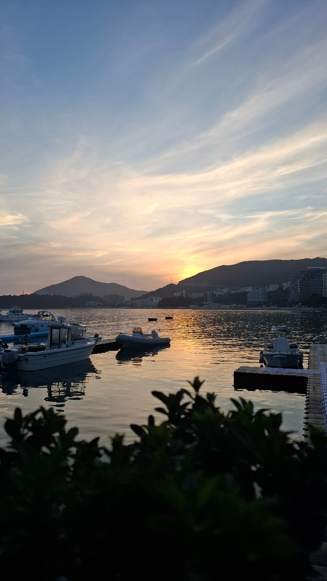 Evening fishing activities observed at Montenegro waterfront during sunset