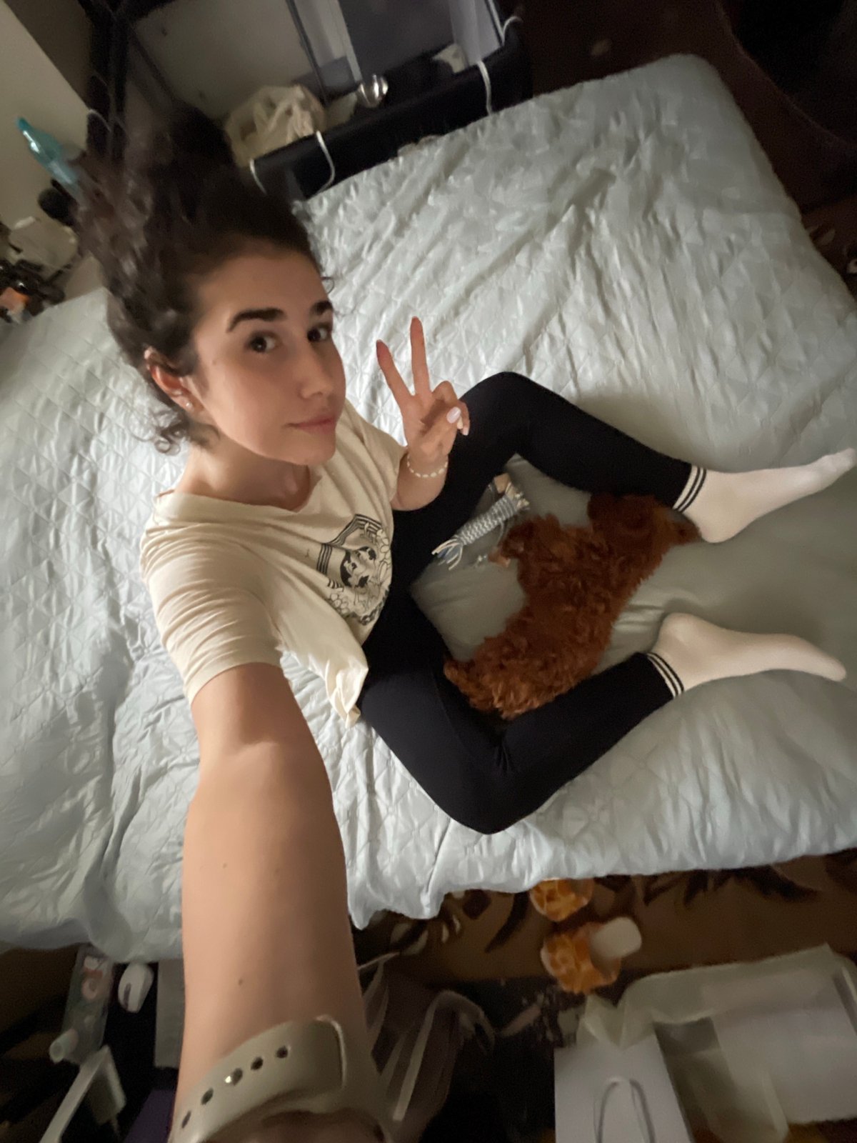 Woman takes afternoon selfies with sleeping dog in Sofia