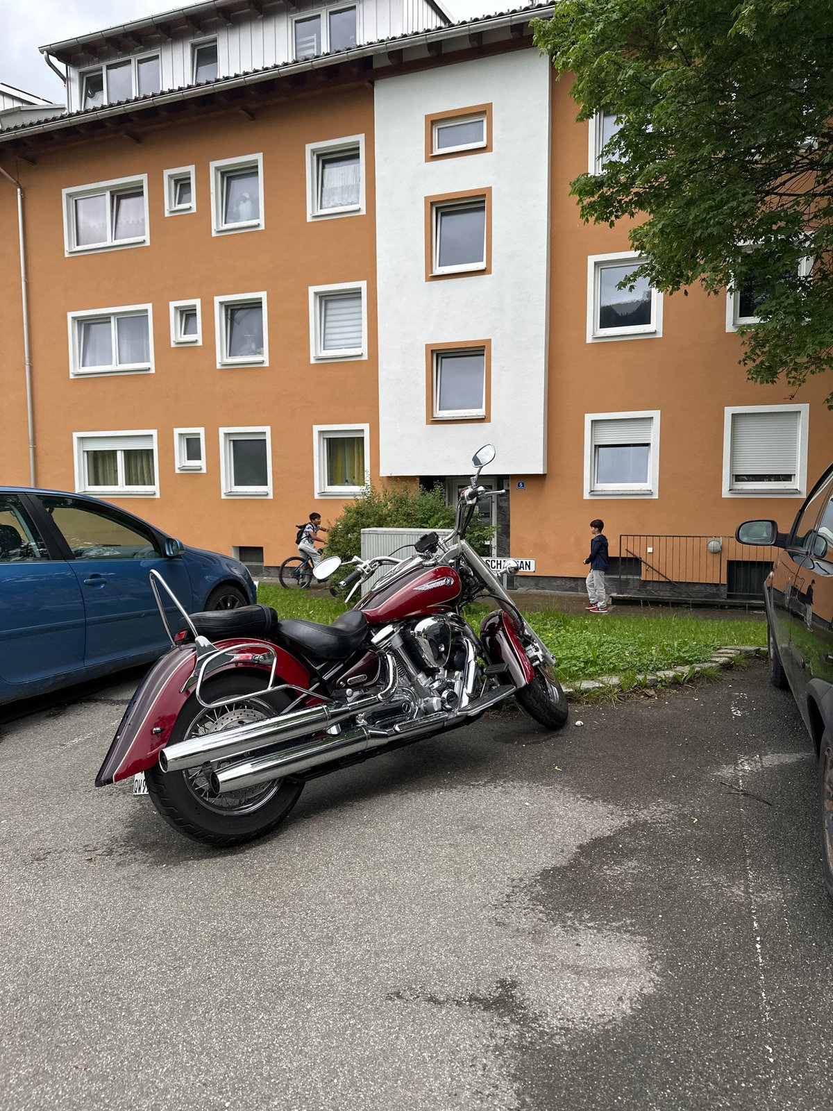 Young man performs split jump on Garmisch-Partenkirchen street