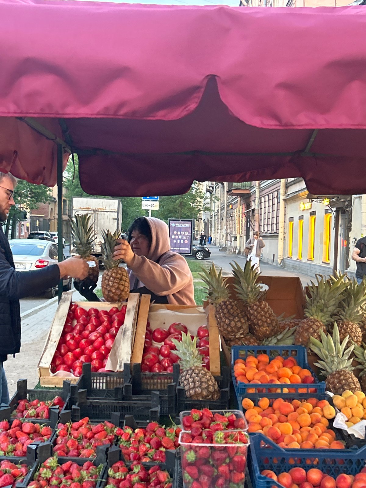 Evening fruit market operates during sunset in Saint Petersburg