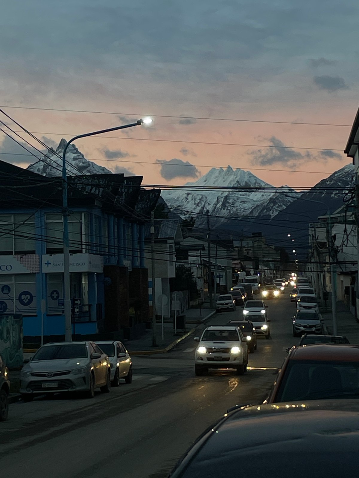 Street scene captured in Ushuaia with mountain backdrop