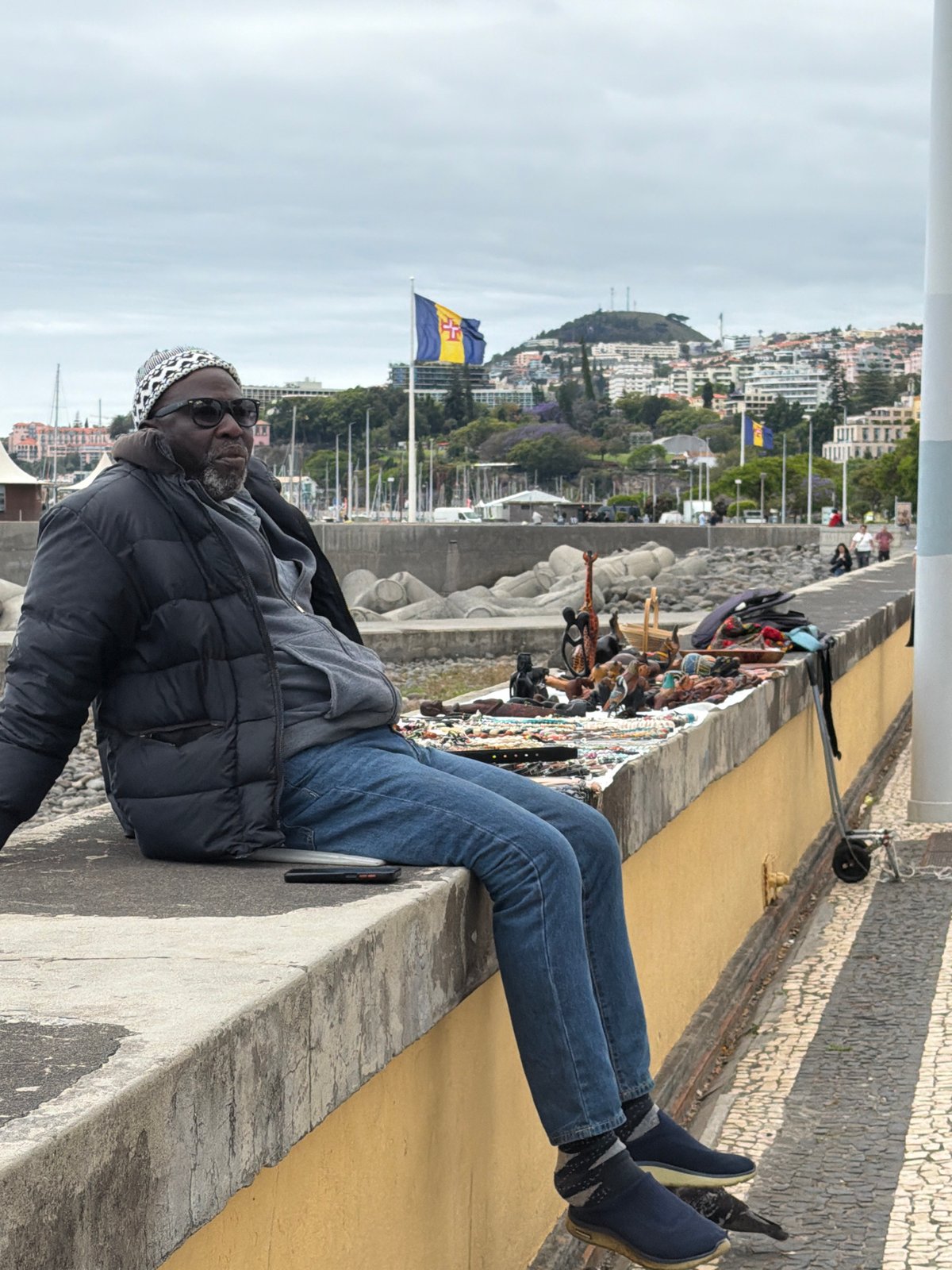 Quiet afternoon moments captured along Funchal's seaside promenade