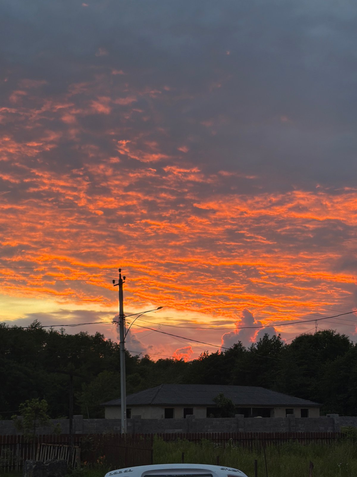 Sunset over Naghbou countryside displays dramatic orange sky