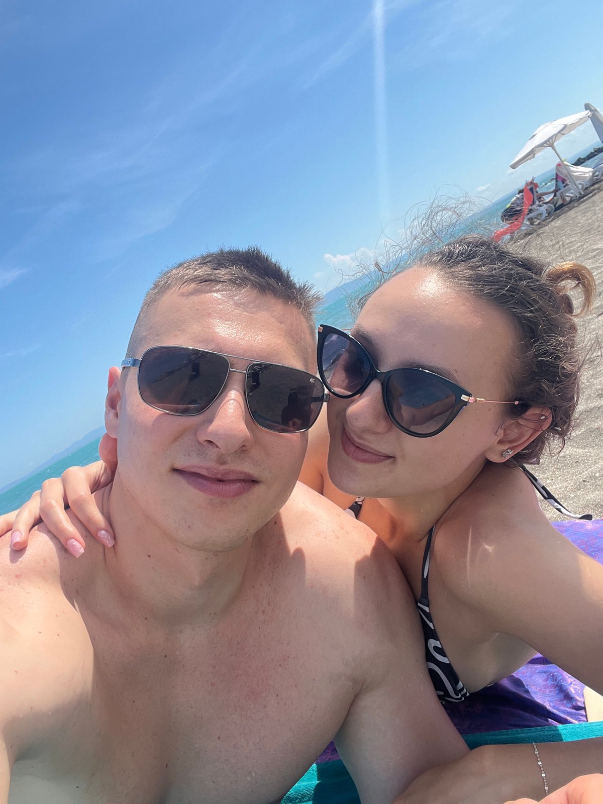 Couple takes beach selfies in Pomorie, Bulgaria