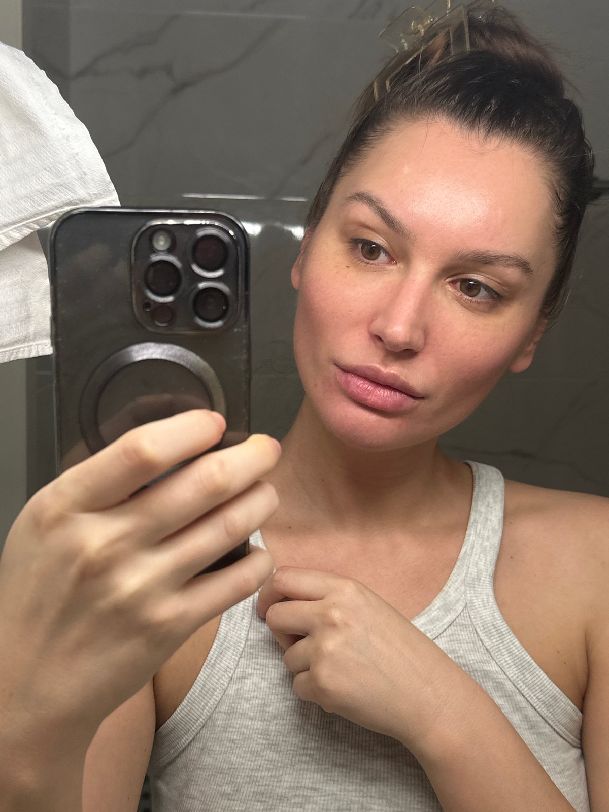 Woman Takes Bathroom Mirror Selfies in Early Morning Moscow